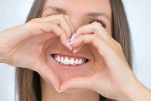 Woman happy with white smile after Blue Light Teeth Whitening Winchester