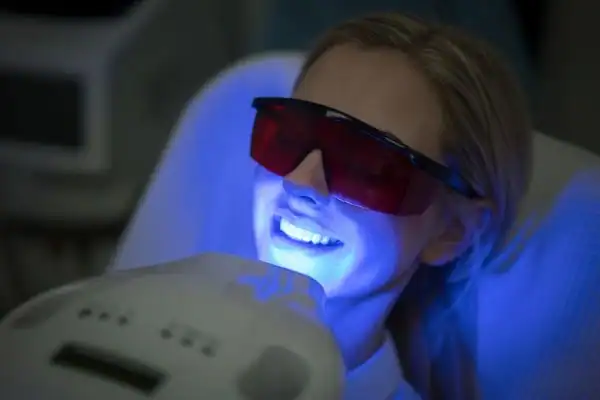 woman getting teeth whitening Winchester